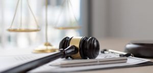 Gavel laying on legal documents