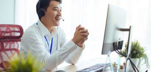 Man wearing a white shirt having a video call