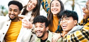 Diverse group of young people from different nationalities smiling