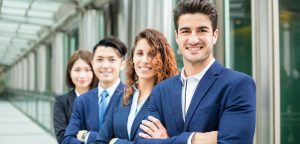 Business professionals wearing suits and standing
