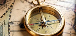 The compas is on the paper map