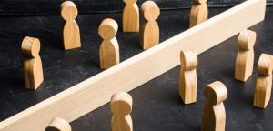 The barrier is between figures