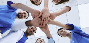 Group of doctors holding hands